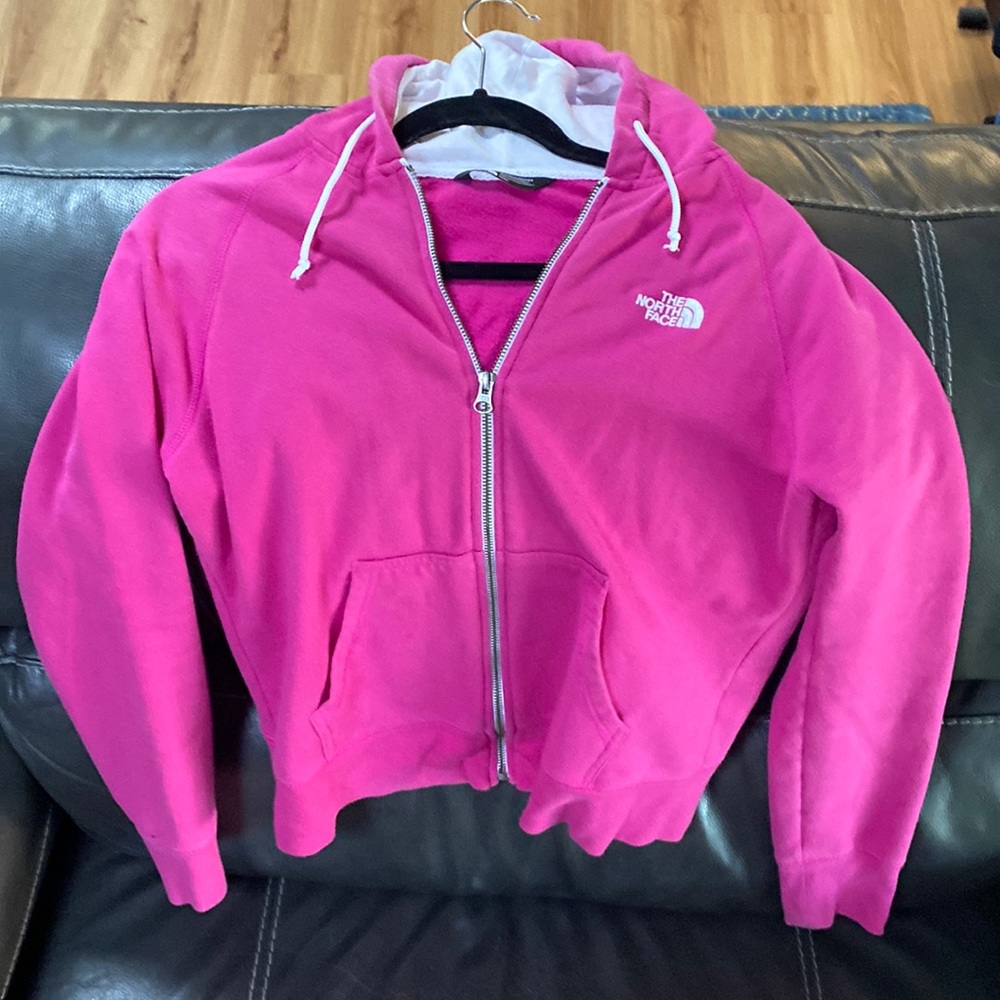 Woman’s NorthFace Zip up Hoodie.